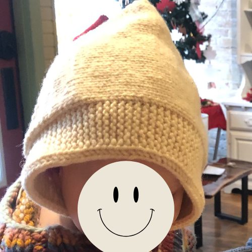 Knitted baby bonnet and model